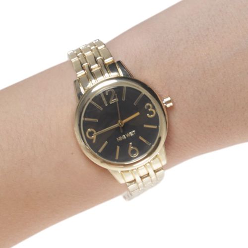 Reloj Nine West análogo de metal dorado para mujer